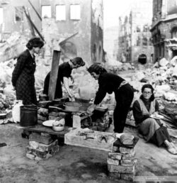 Copyright_LeeMillerArchives_Homeless__Like_the_women_of_German-invaded_countries_German_women_now_cook_in_the_ruins__Nuremberg_Germany_1945.jpg