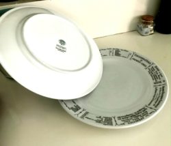two plates angled for spatchcock chicken resting
