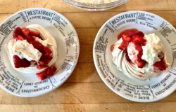 meringue shells filled with strawberries and whipped cream in KD kitchen