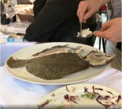 Enzo boning turbot at Re Enzo in Bologna