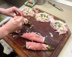 prepping asparagus involtini in a kitchen