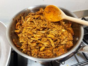 Finished pork carnitas in a Bologna kitchen